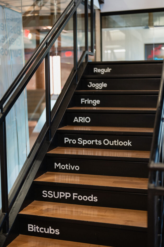 Staircase with Incubator companies names printed on the risers